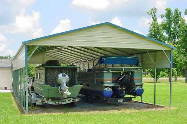 pickup with trailer and boat and additional pontoon boat under carport