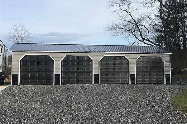 Car and pickups protected from snow in 4 car garage