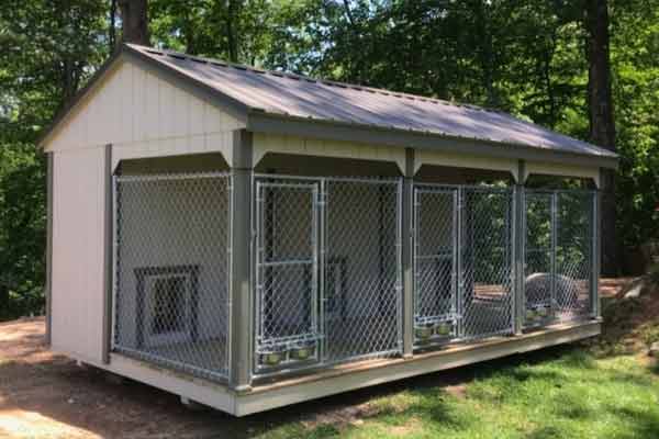 kennel with fenced-in porch, feeding stations, and enclosed dog houses